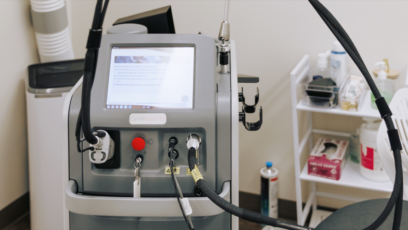 Treatment room with laser machine at Ageless Esthetics Calgary